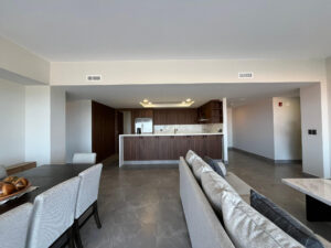 The living, dining and kitchen areas blend together pleasantly