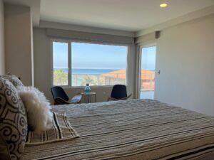 The bedroom is spacious and allows room for an additional sitting area